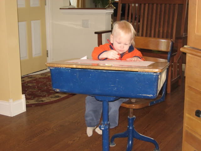 Z at school desk as toddler